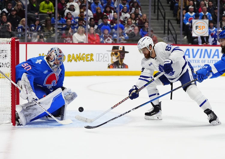 Jan 12, 2026; Denver, Colorado, USA; Toronto Maple Leafs right wing William Nylander (88) shoots the puck at Colorado Avalanche goaltender Trent Miner (50) in the first period at Ball Arena. Credit: Ron Chenoy-Imagn Images