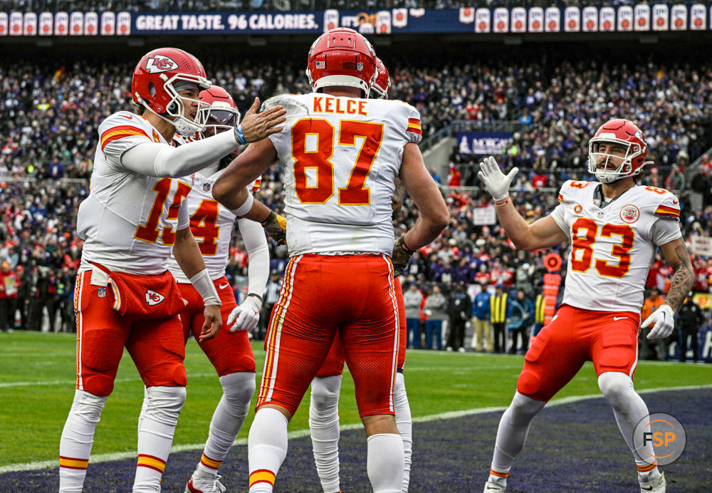 BALTIMORE, MD - JANUARY 28:  Kansas City Chiefs tight end Travis Kelce (87) is congratulated by quarterback Patrick Mahomes (15) and tight end Noah Gray (83) after catching a touchdown pass in the first quarter during the Kansas City Chiefs game versus the Baltimore Ravens in the AFC Championship Game on January 28, 2024 at M&T Bank Stadium in Baltimore, MD.  (Photo by Mark Goldman/Icon Sportswire)