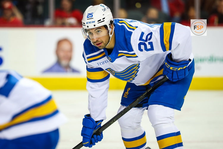 Oct 11, 2025; Calgary, Alberta, CAN; St. Louis Blues right wing Jordan Kyrou (25) during the face off against the Calgary Flames during the third period at Scotiabank Saddledome. Credit: Sergei Belski-Imagn Images