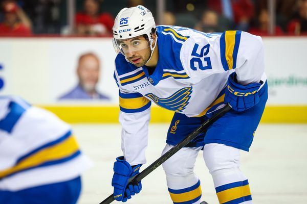 Oct 11, 2025; Calgary, Alberta, CAN; St. Louis Blues right wing Jordan Kyrou (25) during the face off against the Calgary Flames during the third period at Scotiabank Saddledome. Mandatory Credit: Sergei Belski-Imagn Images