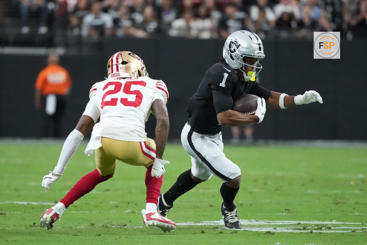 Aug 27, 2026; Paradise, Nevada, USA;  Las Vegas Raiders wide receiver Tre Tucker (1) runs after the catch against San Francisco 49ers cornerback Jack Jones (25) during the first quarter at Allegiant Stadium.  Credit: Kirby Lee-Imagn Images