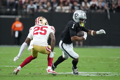 Aug 27, 2026; Paradise, Nevada, USA;  Las Vegas Raiders wide receiver Tre Tucker (1) runs after the catch against San Francisco 49ers cornerback Jack Jones (25) during the first quarter at Allegiant Stadium.  Mandatory Credit: Kirby Lee-Imagn Images
