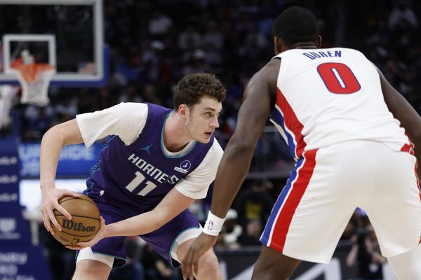 Dec 20, 2025; Detroit, Michigan, USA;  Charlotte Hornets center Ryan Kalkbrenner (11) is defended by Detroit Pistons center Jalen Duren (0) in the second half at Little Caesars Arena. Mandatory Credit: Rick Osentoski-Imagn Images