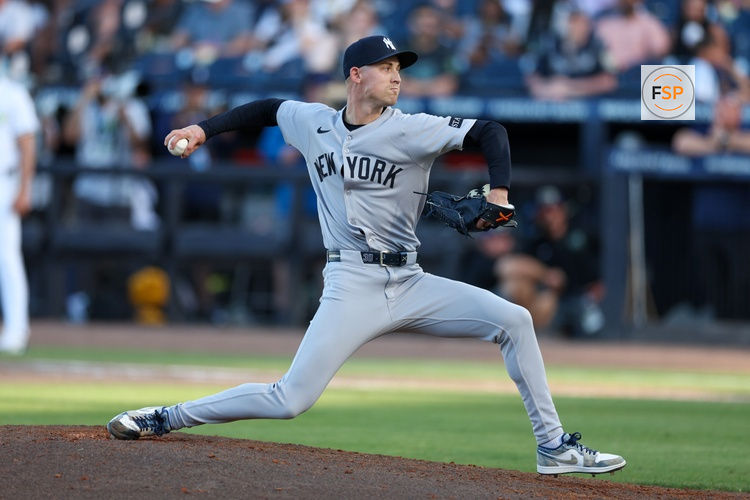 Apr 19, 2025; Tampa, Florida, USA; New York Yankees pitcher Luke Weaver (30) throws a pitch against the Tampa Bay Rays in the eighth inning at George M. Steinbrenner Field. Credit: Nathan Ray Seebeck-Imagn Images