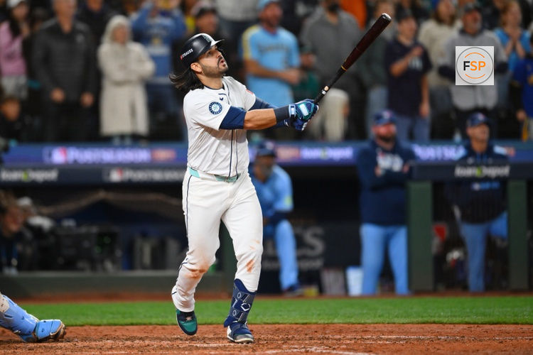 Oct 17, 2025; Seattle, Washington, USA; Seattle Mariners third baseman Eugenio Suarez (28) hits a grand slam against the Toronto Blue Jays during the eighth inning during game five of the ALCS round for the 2025 MLB playoffs at T-Mobile Park. Credit: Steven Bisig-Imagn Images