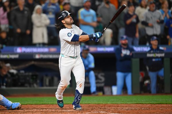 Oct 17, 2025; Seattle, Washington, USA; Seattle Mariners third baseman Eugenio Suarez (28) hits a grand slam against the Toronto Blue Jays during the eighth inning during game five of the ALCS round for the 2025 MLB playoffs at T-Mobile Park. Mandatory Credit: Steven Bisig-Imagn Images