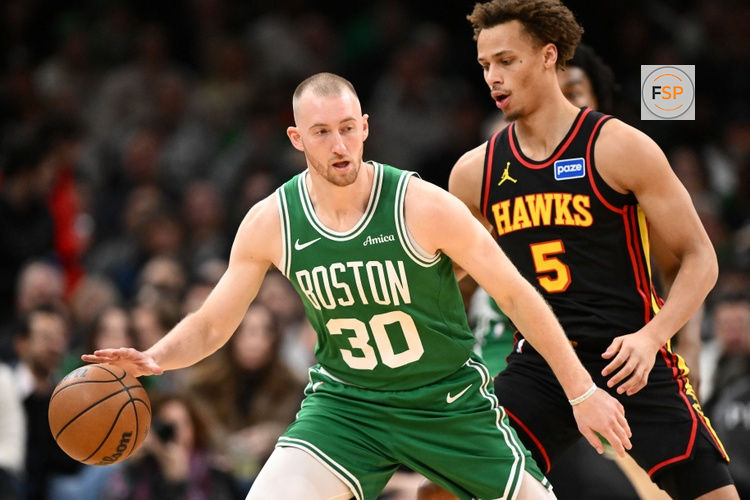 Jan 28, 2026; Boston, Massachusetts, USA; Boston Celtics forward Sam Hauser (30) controls the ball against Atlanta Hawks guard Dyson Daniels (5) during the first half at the TD Garden. Credit: Brian Fluharty-Imagn Images