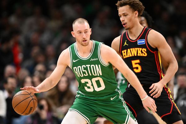 Jan 28, 2026; Boston, Massachusetts, USA; Boston Celtics forward Sam Hauser (30) controls the ball against Atlanta Hawks guard Dyson Daniels (5) during the first half at the TD Garden. Mandatory Credit: Brian Fluharty-Imagn Images