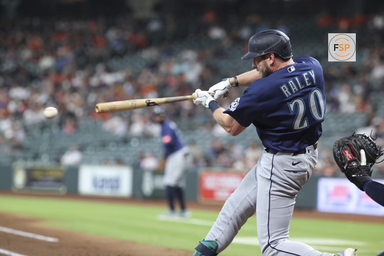 May 13, 2026; Houston, Texas, USA; Seattle Mariners right fielder Luke Raley (20) hits a single during the second inning against the Houston Astros at Daikin Park. Credit: Troy Taormina-Imagn Images