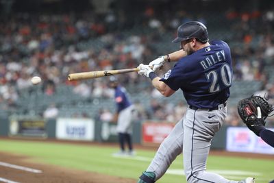 May 13, 2026; Houston, Texas, USA; Seattle Mariners right fielder Luke Raley (20) hits a single during the second inning against the Houston Astros at Daikin Park. Mandatory Credit: Troy Taormina-Imagn Images