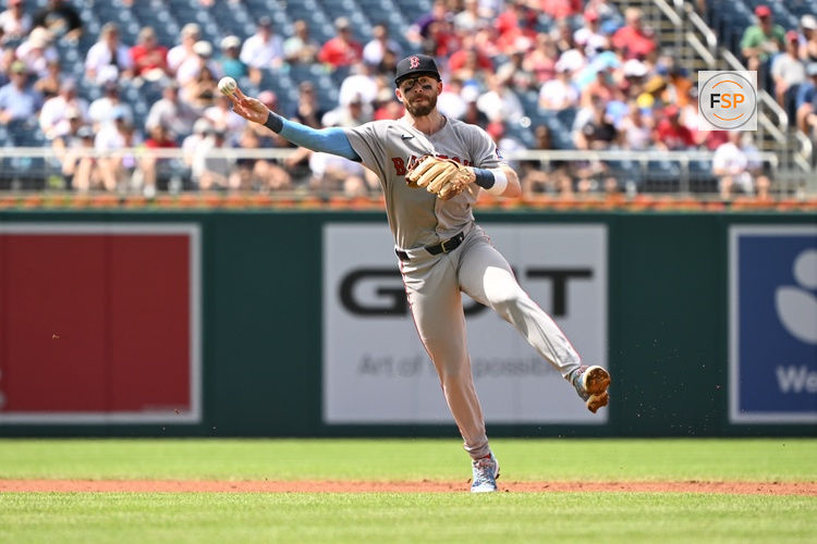 Jul 6, 2025; Washington, District of Columbia, USA; Boston Red Sox shortstop Trevor Story (10) attempts a throw to first base against the Washington Nationals during the sixth inning at Nationals Park. Credit: Rafael Suanes-Imagn Images