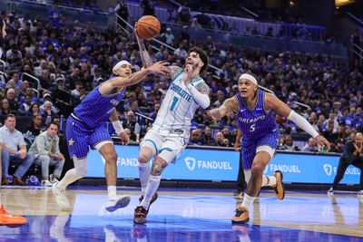 Apr 17, 2026; Orlando, Florida, USA; Charlotte Hornets guard LaMelo Ball (1) is fouled by Orlando Magic guard Anthony Black (0) during the second half during the play-in rounds of the 2026 NBA Playoffs at Kia Center. Mandatory Credit: Mike Watters-Imagn Images