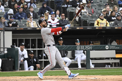 Apr 13, 2025; Chicago, Illinois, USA;  Boston Red Sox shortstop Trevor Story (10 )  hits a two RBI double during the sixth inning against the Chicago White Sox at Guaranteed Rate Field. Mandatory Credit: Matt Marton-Imagn Images