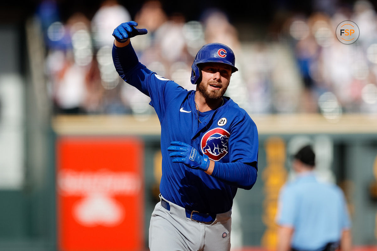 Sep 15, 2024; Denver, Colorado, USA; Chicago Cubs first baseman Michael Busch (29) gestures as he rounds the bases on a solo home run in the ninth inning against the Colorado Rockies at Coors Field. Credit: Isaiah J. Downing-Imagn Images