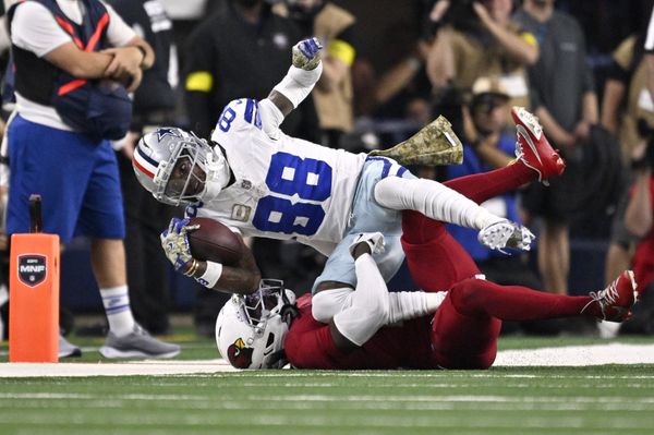 Nov 3, 2025; Arlington, Texas, USA; Arizona Cardinals cornerback Will Johnson (0) tackles Dallas Cowboys wide receiver CeeDee Lamb (88) in the second half at AT&T Stadium. Mandatory Credit: Jerome Miron-Imagn Images