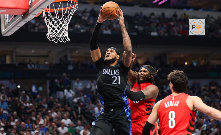 Nov 16, 2025; Dallas, Texas, USA;  Dallas Mavericks forward Daniel Gafford (21) scores past Portland Trail Blazers center Robert Williams III (35) during the second quarter at American Airlines Center. Credit: Kevin Jairaj-Imagn Images