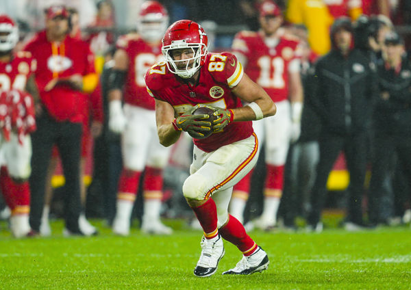 Nov 4, 2024; Kansas City, Missouri, USA; Kansas City Chiefs tight end Travis Kelce (87) runs with the ball during the second half against the Tampa Bay Buccaneers at GEHA Field at Arrowhead Stadium. Mandatory Credit: Jay Biggerstaff-Imagn Images