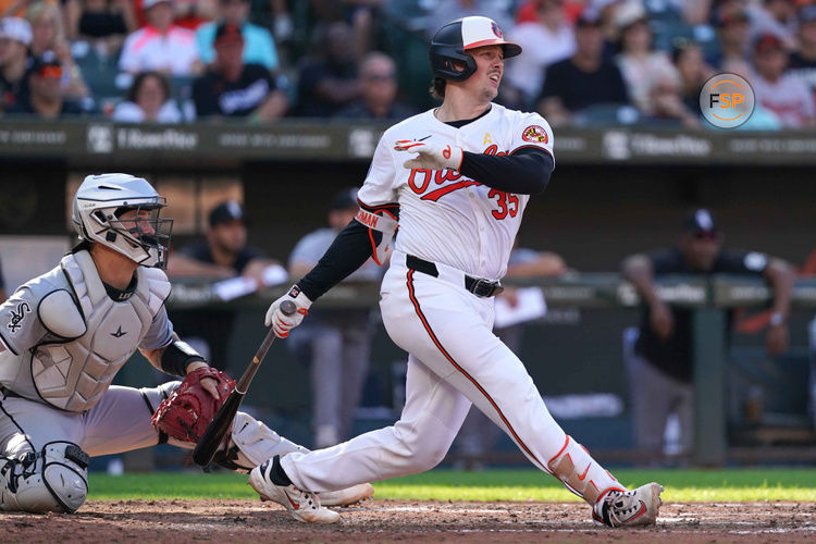 Sep 2, 2024; Baltimore, Maryland, USA; Baltimore Orioles catcher Adley Rutschman (35) drives in a run during the fifth inning against the Chicago White Sox at Oriole Park at Camden Yards. Credit: Mitch Stringer-USA TODAY Sports