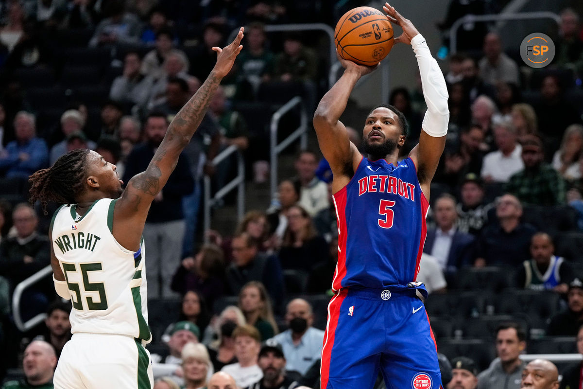 Nov 13, 2024; Milwaukee, Wisconsin, USA;  Detroit Pistons guard Malik Beasley (5) shoots against Milwaukee Bucks guard Delon Wright (55) during the third quarter at Fiserv Forum. Credit: Jeff Hanisch-Imagn Images