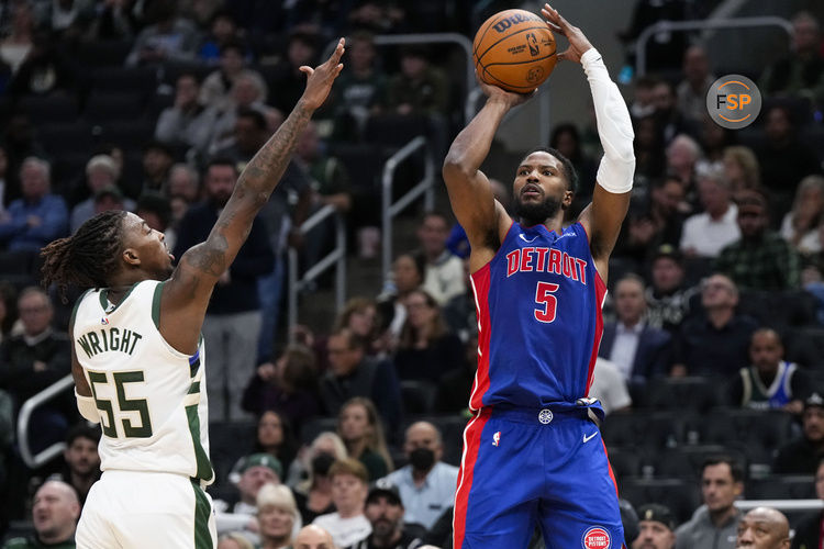 Nov 13, 2024; Milwaukee, Wisconsin, USA;  Detroit Pistons guard Malik Beasley (5) shoots against Milwaukee Bucks guard Delon Wright (55) during the third quarter at Fiserv Forum. Credit: Jeff Hanisch-Imagn Images