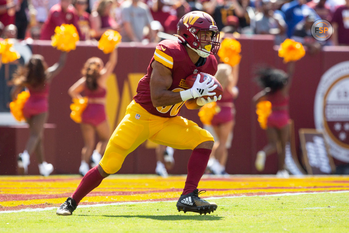 Sep 15, 2024; Landover, Maryland, USA;  Washington Commanders running back Austin Ekeler (30) receives the opening kickoff in the first quarter against the New York Giants at Commanders Field. Credit: Luke Johnson-Imagn Images

