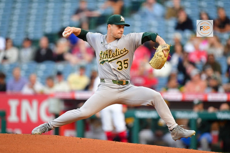 May 18, 2026; Anaheim, California, USA; Athletics pitcher J.T. Ginn (35) throws against the Los Angeles Angels during the first inning at Angel Stadium. Credit: Gary A. Vasquez-Imagn Images