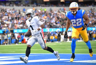 Sep 20, 2026; Inglewood, California, USA;  Las Vegas Raiders wide receiver Tre Tucker (1) scores a touchdown past Los Angeles Chargers safety Genesis Smith (22) during the first half at SoFi Stadium.  Mandatory Credit: Gary A. Vasquez-Imagn Images