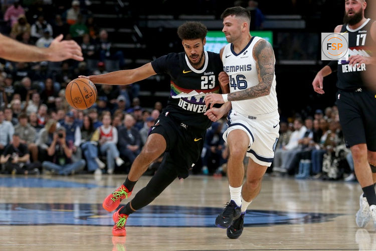 Nov 24, 2025; Memphis, Tennessee, USA; Denver Nuggets forward Cameron Johnson (23) drives to the basket as Memphis Grizzlies John Konchar (46) defends during the second quarter at FedExForum. Credit: Petre Thomas-Imagn Images