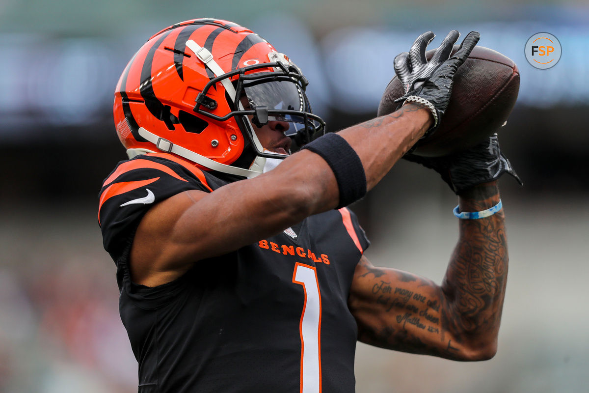 Dec 16, 2023; Cincinnati, Ohio, USA; Cincinnati Bengals wide receiver Ja'Marr Chase (1) catches a pass during warmups before the game against the Minnesota Vikings at Paycor Stadium. Credit: Katie Stratman-USA TODAY Sports