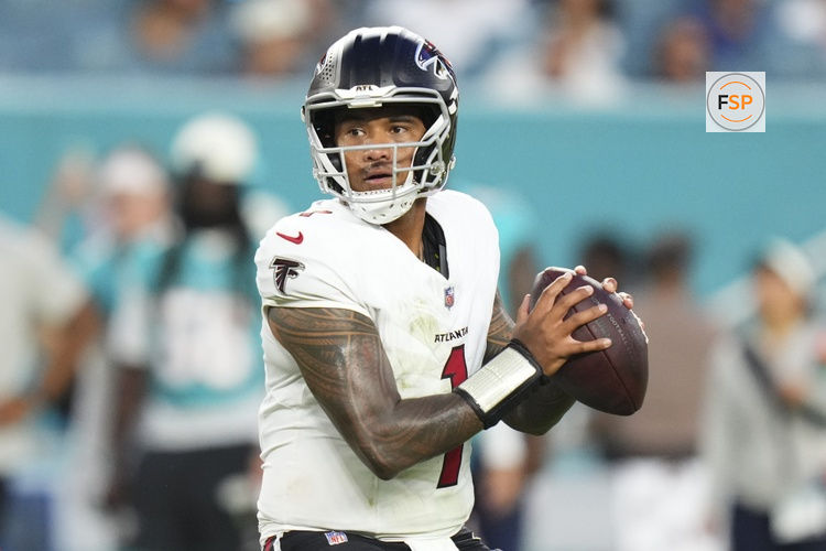 Aug 28, 2026; Miami Gardens, Florida, USA;  Atlanta Falcons quarterback Tua Tagovailoa (1) throws a pass against the Miami Dolphins during the first quarter of a pre season game at Hard Rock Stadium.  Credit: Rich Storry-Imagn Images