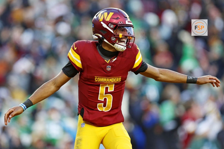 Dec 22, 2024; Landover, Maryland, USA; Washington Commanders quarterback Jayden Daniels (5) celebrates after throwing a touchdown during the fourth quarter against the Philadelphia Eagles at Northwest Stadium. Credit: Peter Casey-Imagn Images