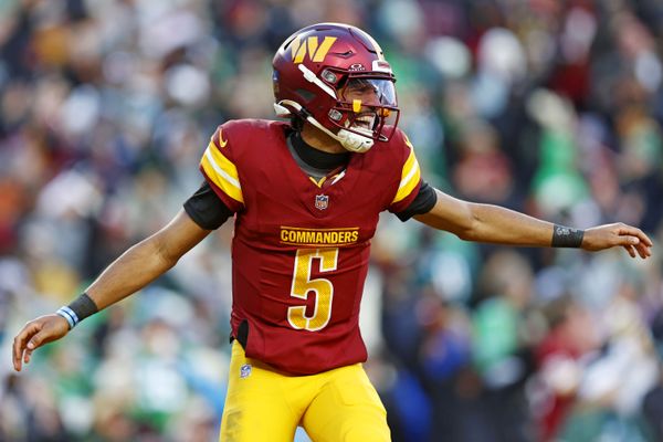 Dec 22, 2024; Landover, Maryland, USA; Washington Commanders quarterback Jayden Daniels (5) celebrates after throwing a touchdown during the fourth quarter against the Philadelphia Eagles at Northwest Stadium. Mandatory Credit: Peter Casey-Imagn Images