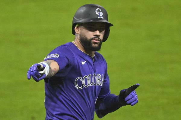 Jul 28, 2025; Cleveland, Ohio, USA; Colorado Rockies first baseman Warming Bernabel (25) celebrates his solo home run in the sixth inning against the Cleveland Guardians at Progressive Field. Mandatory Credit: David Richard-Imagn Images