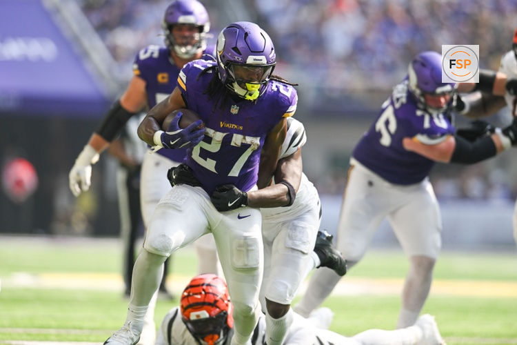 Sep 21, 2025; Minneapolis, Minnesota, USA; Minnesota Vikings running back Jordan Mason (27) carries the ball against the Cincinnati Bengals during the second half at U.S. Bank Stadium. Credit: Jeffrey Becker-Imagn Images