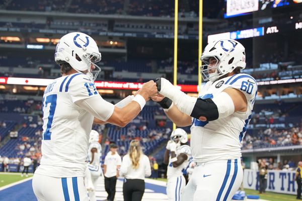 Sep 14, 2025; Indianapolis, Indiana, USA; Indianapolis Colts quarterback Daniel Jones (17) and center Tanor Bortolini (60) warm up prior to the game against the Denver Broncos at Lucas Oil Stadium. Mandatory Credit: Robert Goddin-Imagn Images