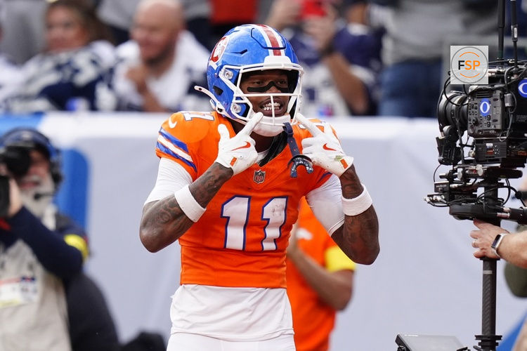 Oct 26, 2025; Denver, Colorado, USA;  Denver Broncos wide receiver Troy Franklin (11) celebrates after scoring a touchdown against the Dallas Cowboys in the fourth quarter at Empower Field at Mile High. Credit: Ron Chenoy-Imagn Images
