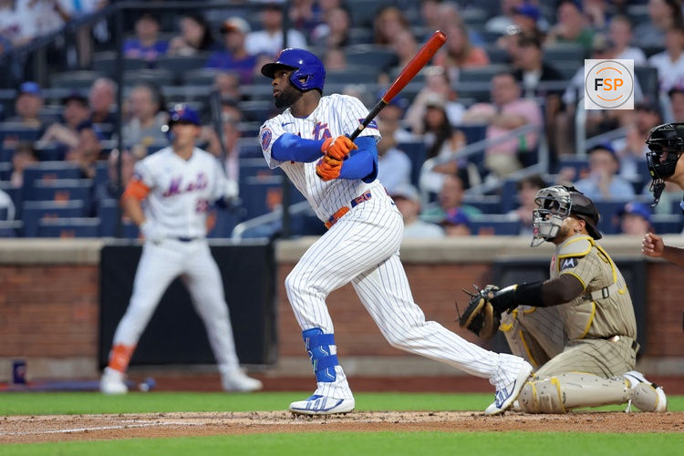 Aug 17, 2026; New York City, New York, USA; New York Mets center fielder Luis Robert Jr. (88) follows through on an RBI sacrifice fly against the San Diego Padres during the first inning at Citi Field. Credit: Brad Penner-Imagn Images