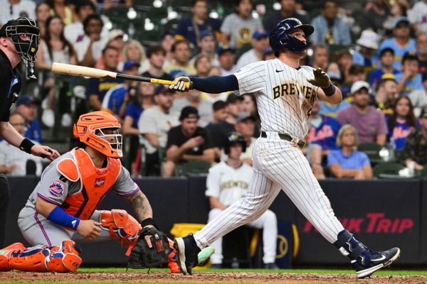 Aug 10, 2025; Milwaukee, Wisconsin, USA;  Milwaukee Brewers left fielder Isaac Collins (6) hits a walk off home run in the ninth inning in front of New York Mets catcher Luis Torrens (13) at American Family Field. Mandatory Credit: Benny Sieu-Imagn Images