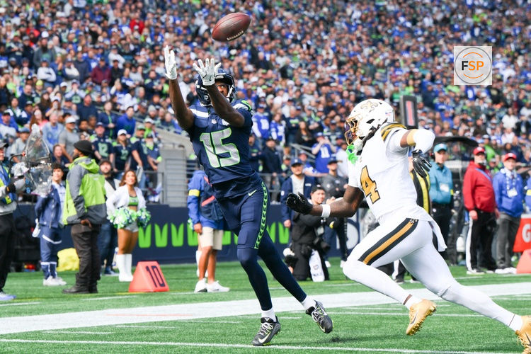 Sep 21, 2025; Seattle, Washington, USA; Seattle Seahawks wide receiver Tory Horton (15) catches the ball for a touchdown during the second quarter against the New Orleans Saints at Lumen Field. Credit: Steven Bisig-Imagn Images