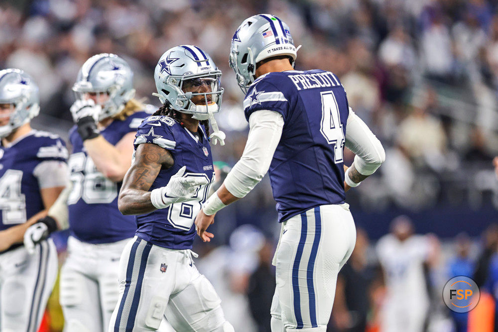 ARLINGTON, TX - DECEMBER 30: Dallas Cowboys wide receiver CeeDee Lamb (88) celebrates with quarterback Dak Prescott (4) after catching a pass for a touchdown during the game between the Dallas Cowboys and the Detroit Lions on December 30, 2023 at AT&T Stadium in Arlington, Texas. (Photo by Matthew Pearce/Icon Sportswire)