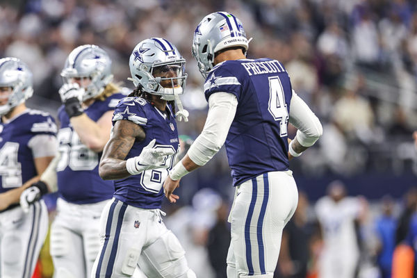 ARLINGTON, TX - DECEMBER 30: Dallas Cowboys wide receiver CeeDee Lamb (88) celebrates with quarterback Dak Prescott (4) after catching a pass for a touchdown during the game between the Dallas Cowboys and the Detroit Lions on December 30, 2023 at AT&T Stadium in Arlington, Texas. (Photo by Matthew Pearce/Icon Sportswire)