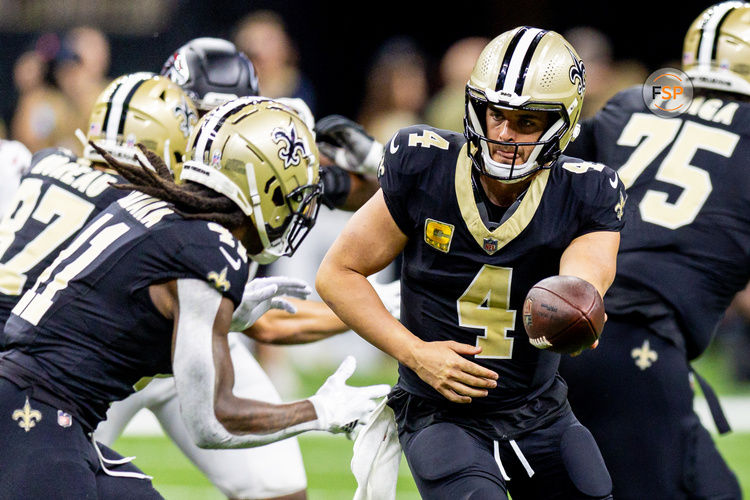 Nov 10, 2024; New Orleans, Louisiana, USA;   New Orleans Saints quarterback Derek Carr (4) hands off to running back Alvin Kamara (41) against the Atlanta Falcons during the first half at Caesars Superdome. Credit: Stephen Lew-Imagn Images