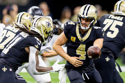 Nov 10, 2024; New Orleans, Louisiana, USA;   New Orleans Saints quarterback Derek Carr (4) hands off to running back Alvin Kamara (41) against the Atlanta Falcons during the first half at Caesars Superdome. Mandatory Credit: Stephen Lew-Imagn Images