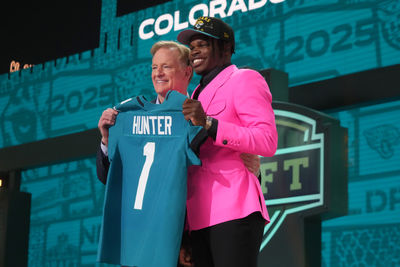 Apr 24, 2025; Green Bay, WI, USA; NFL commissioner Roger Goodell stands with Colorado Buffaloes wide receiver Travis Hunter after he is selected by the Jacksonville Jaguars as the number two pick in the first round of the 2025 NFL Draft at Lambeau Field. Mandatory Credit: Kirby Lee-Imagn Images