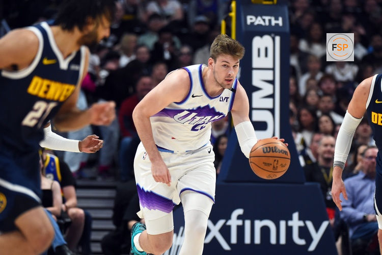 Mar 27, 2026; Denver, Colorado, USA; Utah Jazz forward Kyle Filipowski (22) moves the ball up the floor during the first half against the Denver Nuggets at Ball Arena. Credit: Christopher Hanewinckel-Imagn Images