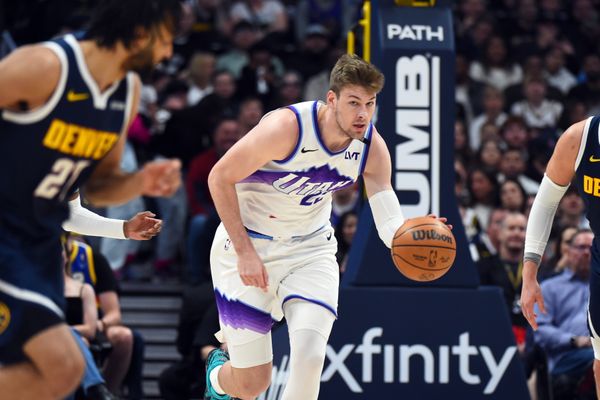 Mar 27, 2026; Denver, Colorado, USA; Utah Jazz forward Kyle Filipowski (22) moves the ball up the floor during the first half against the Denver Nuggets at Ball Arena. Mandatory Credit: Christopher Hanewinckel-Imagn Images