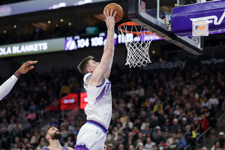 Dec 18, 2025; Salt Lake City, Utah, USA;  Utah Jazz center Kyle Filipowski (22) dunks during the second half against the Los Angeles Lakers at Delta Center. Credit: Chris Nicoll-Imagn Images