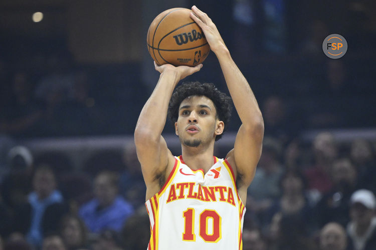 Jan 30, 2025; Cleveland, Ohio, USA; Atlanta Hawks forward Zaccharie Risacher (10) shoots in the first quarter against the Cleveland Cavaliers at Rocket Mortgage FieldHouse. Credit: David Richard-Imagn Images