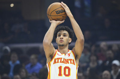 Jan 30, 2025; Cleveland, Ohio, USA; Atlanta Hawks forward Zaccharie Risacher (10) shoots in the first quarter against the Cleveland Cavaliers at Rocket Mortgage FieldHouse. Mandatory Credit: David Richard-Imagn Images