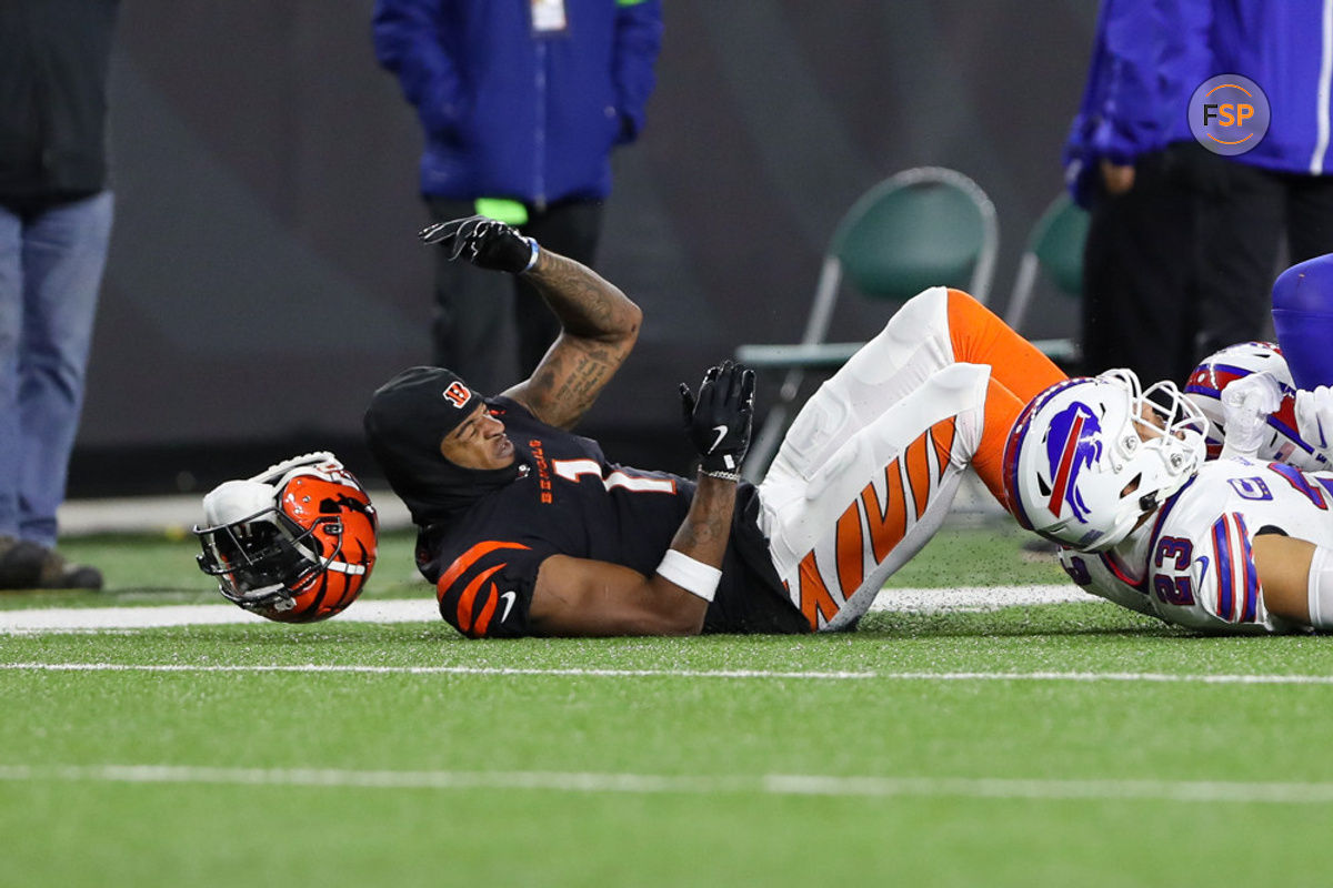 CINCINNATI, OH - NOVEMBER 05: Cincinnati Bengals wide receiver Ja'Marr Chase (1) loses his helmet after hitting the turf while attempting to catch a pass during the game against the Buffalo Bills and the Cincinnati Bengals on November 5, 2023, at Paycor Stadium in Cincinnati, OH. (Photo by Ian Johnson/Icon Sportswire)